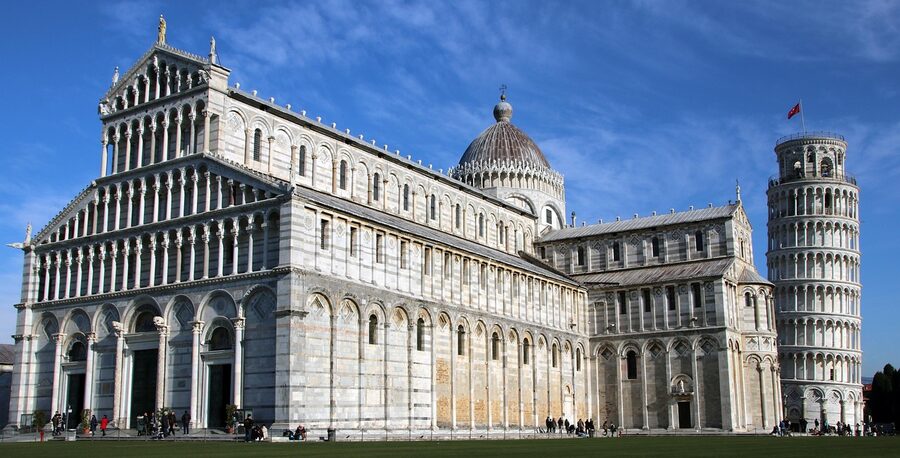 The Pisa Cathedral and Leaning Tower bell tower seen from the square