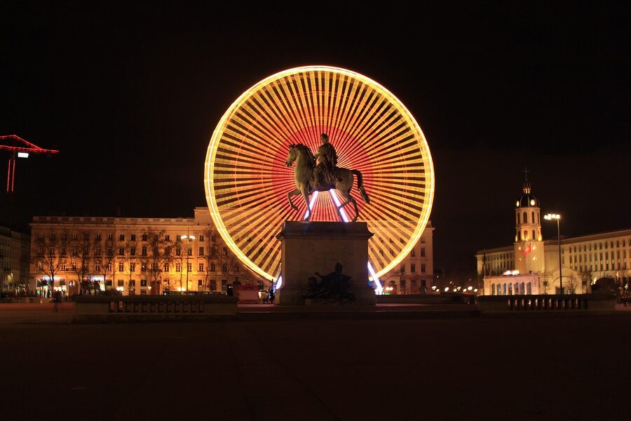 Ferris wheel at Place Bellecour with Hotel Royal in Lyon