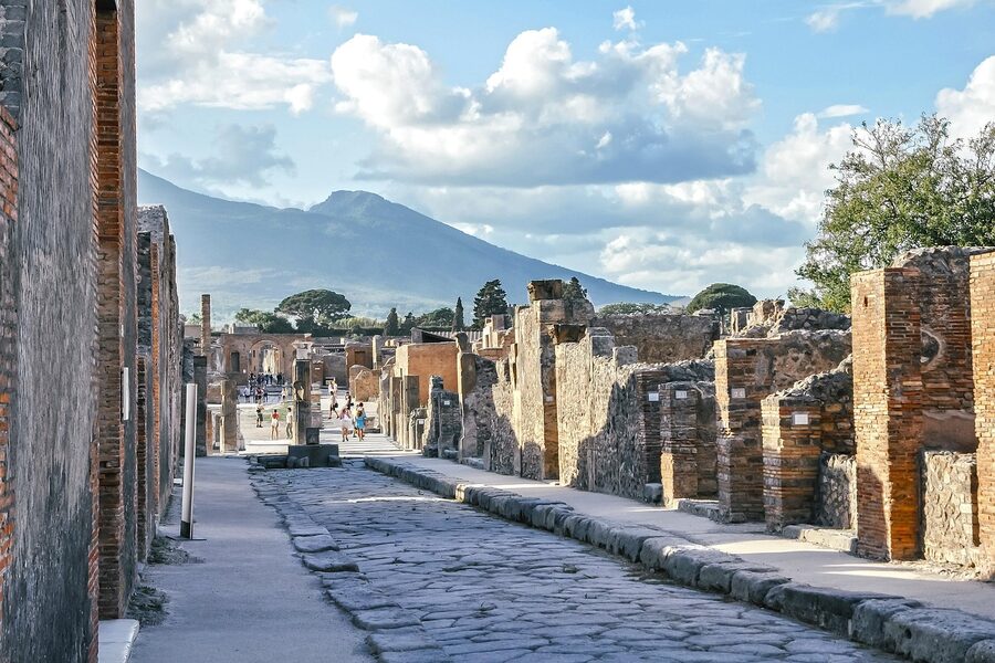 Pompeii excavated street with Vesuvius