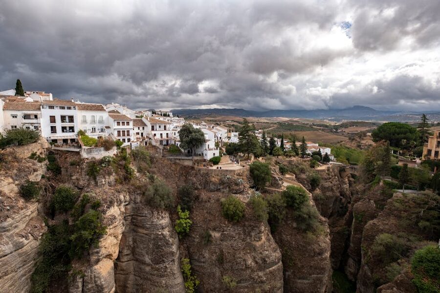 Ronda cliffside architecture against dramatic sky
