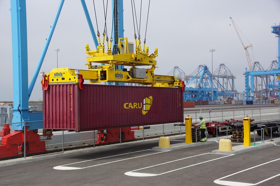 A close-up of stacked shipping containers in the Port of Rotterdam