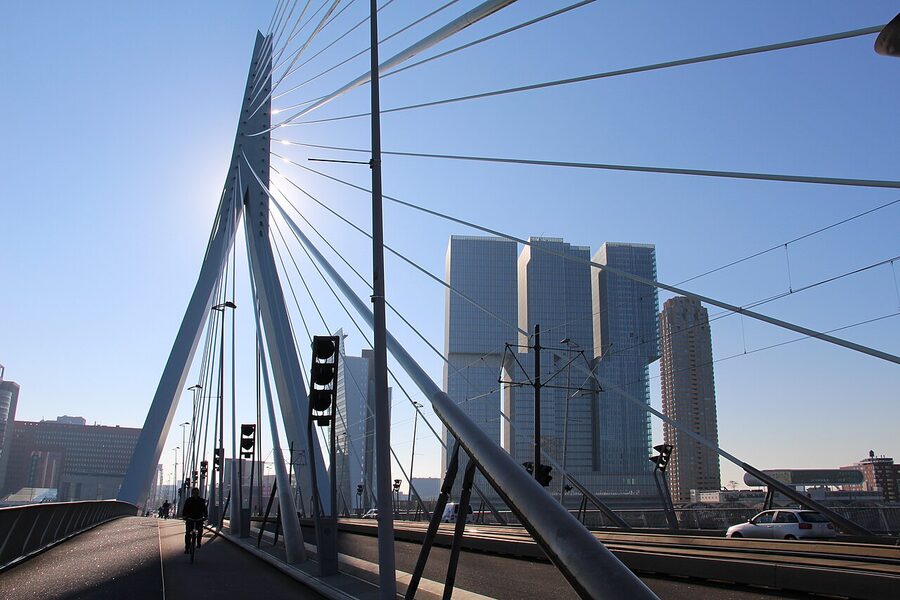 The Erasmus Bridge with the De Rotterdam tower complex by Rem Koolhaas behind it on the Wilhelminakade