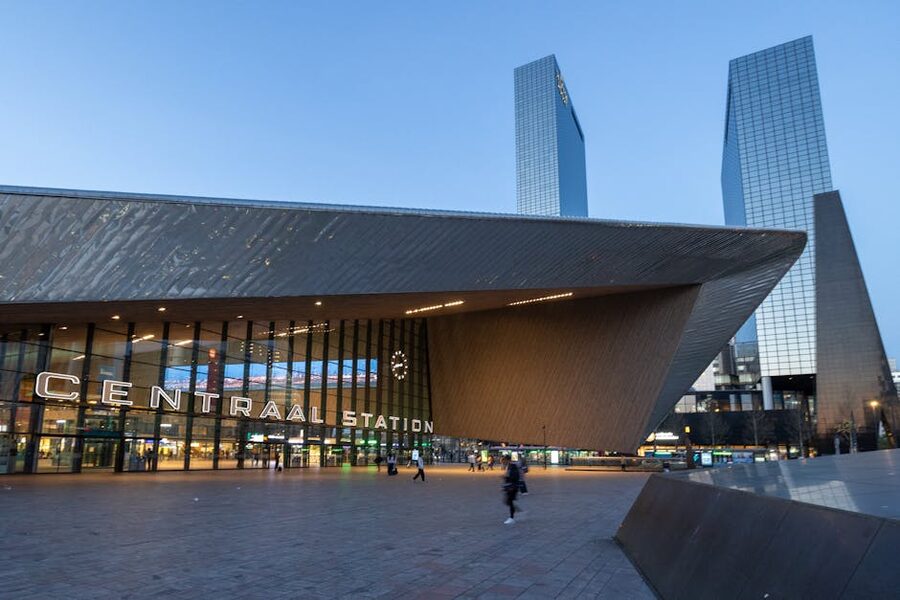 Rotterdam Centraal Station at twilight with its angular modern architecture and the city skyline behind