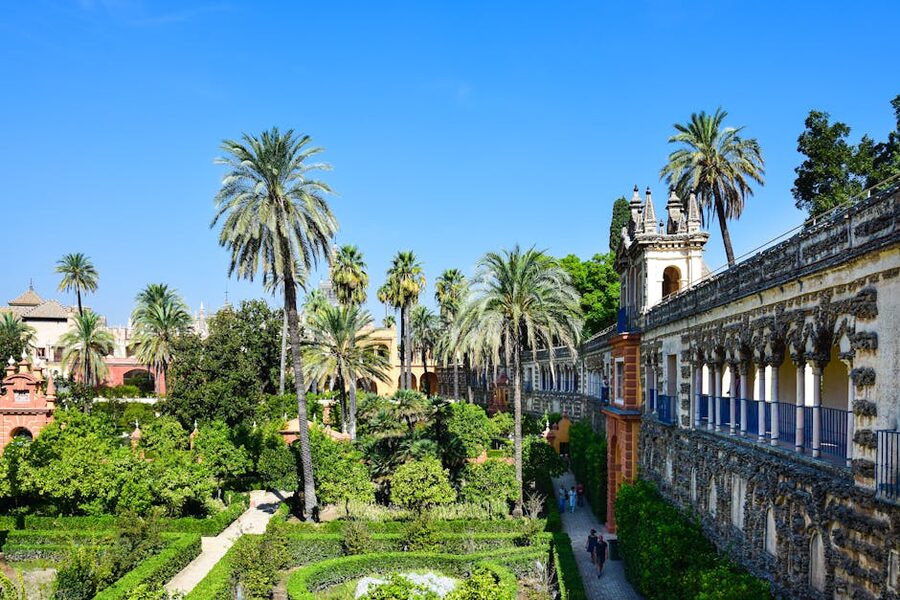 Alcazar of Seville garden path with hedges