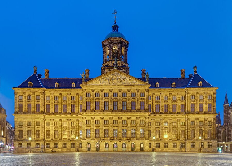 Royal Palace Amsterdam at blue hour seen from across Dam Square