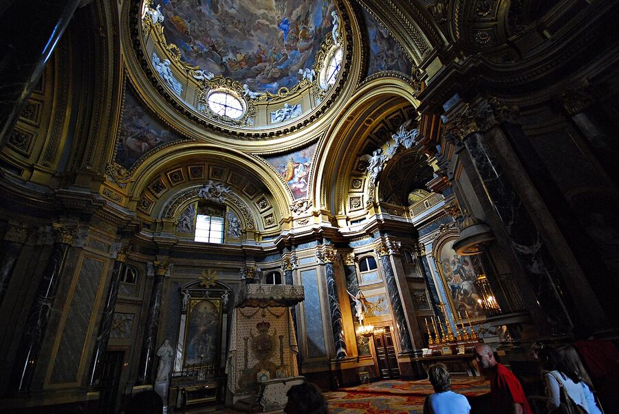 Gilded interior room of Royal Palace Madrid with chandeliers