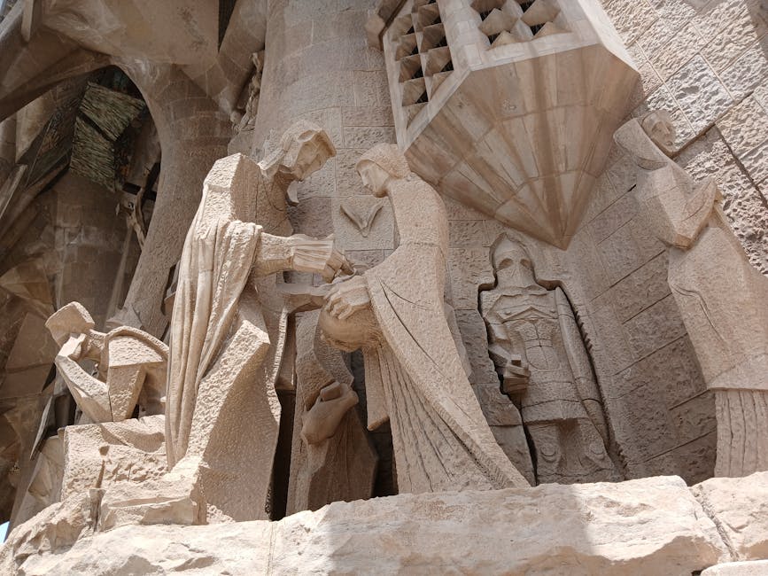 Detailed stone sculptures on the facade of Sagrada Familia