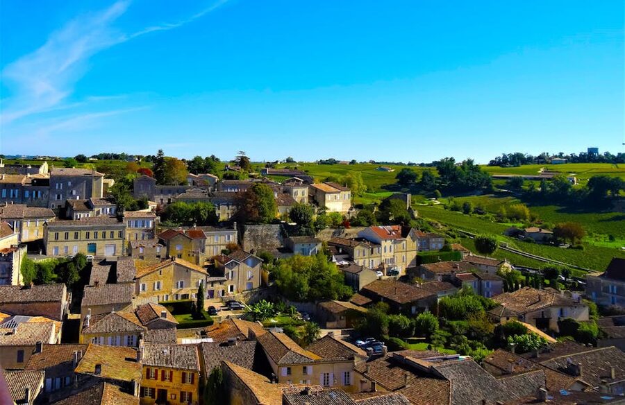Aerial view of Saint Emilion village rooftops with vineyards