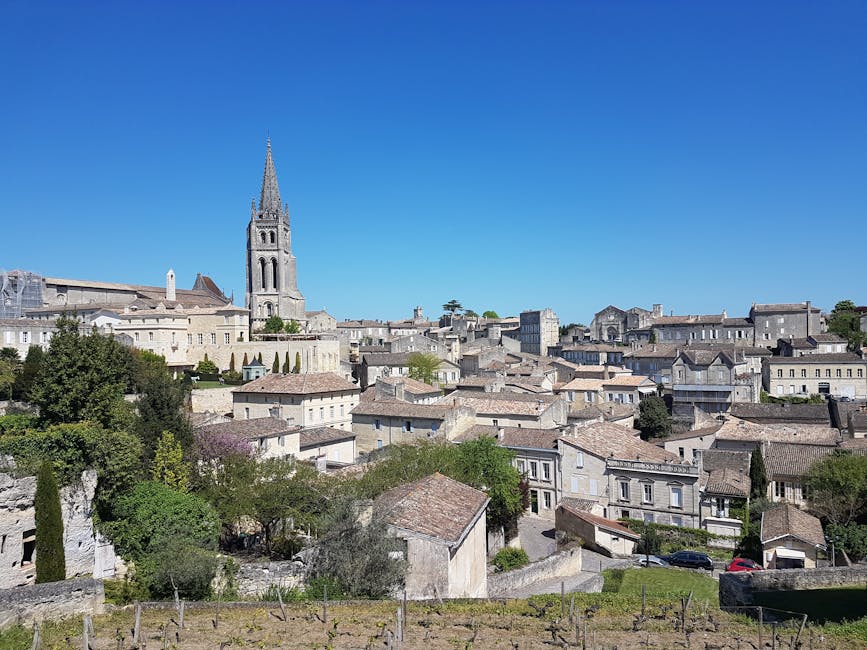 Monolithic Church bell tower above the medieval rooftops of Saint-Émilion