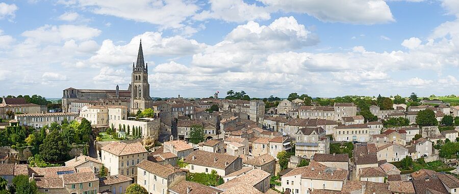 Panoramic view from the Tour du Roy over Saint-Émilion's limestone roofs
