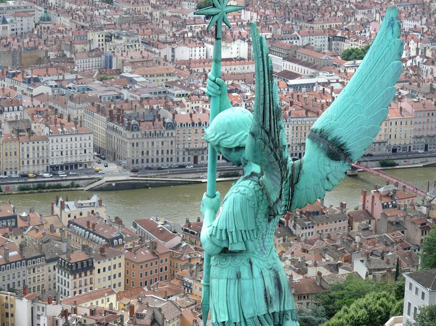 Statue overlook from Fourviere with Lyon city below