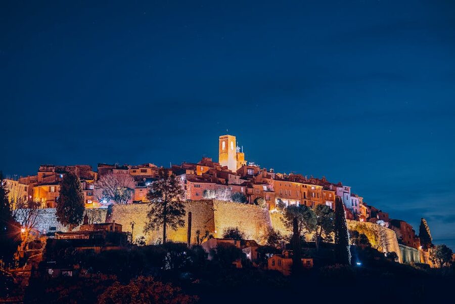 Saint-Paul-de-Vence bell tower at evening with illuminated stone