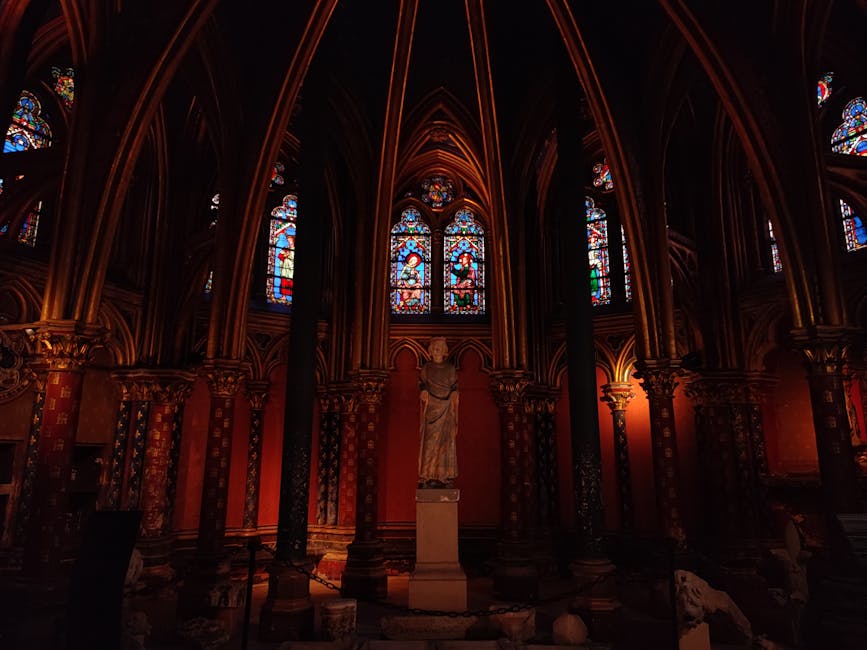 Sainte-Chapelle stained glass with statue and gothic interior