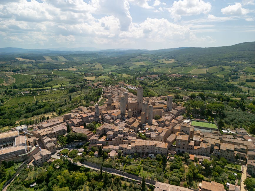 Aerial view of San Gimignano with its medieval towers stacked on the ridge