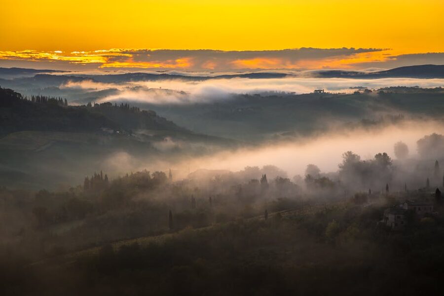 Sunrise over fog-covered hills near San Gimignano