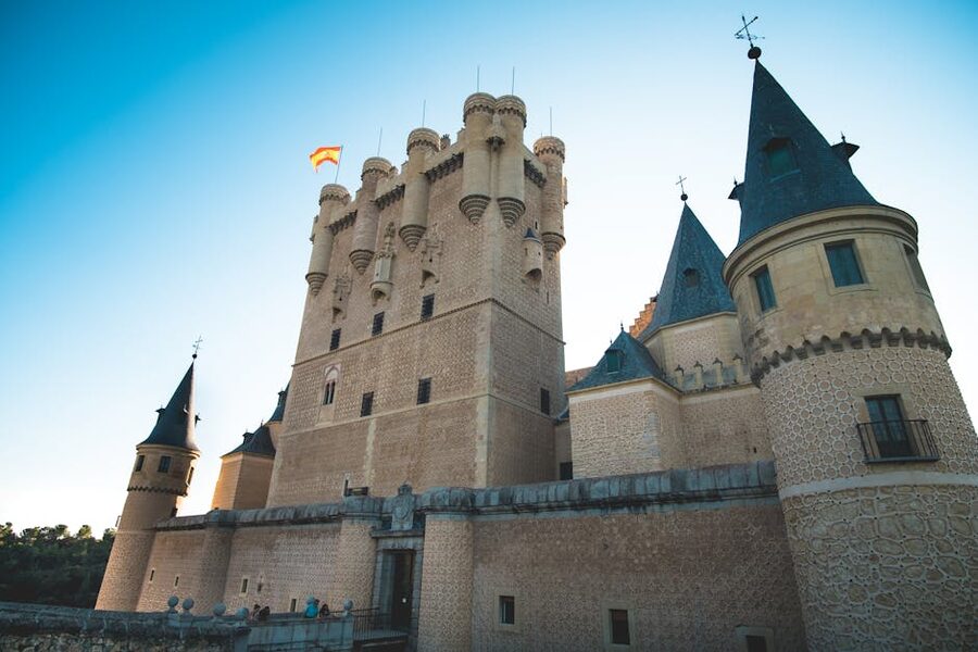 Alcazar of Segovia from outside with stone walls and pointed turrets