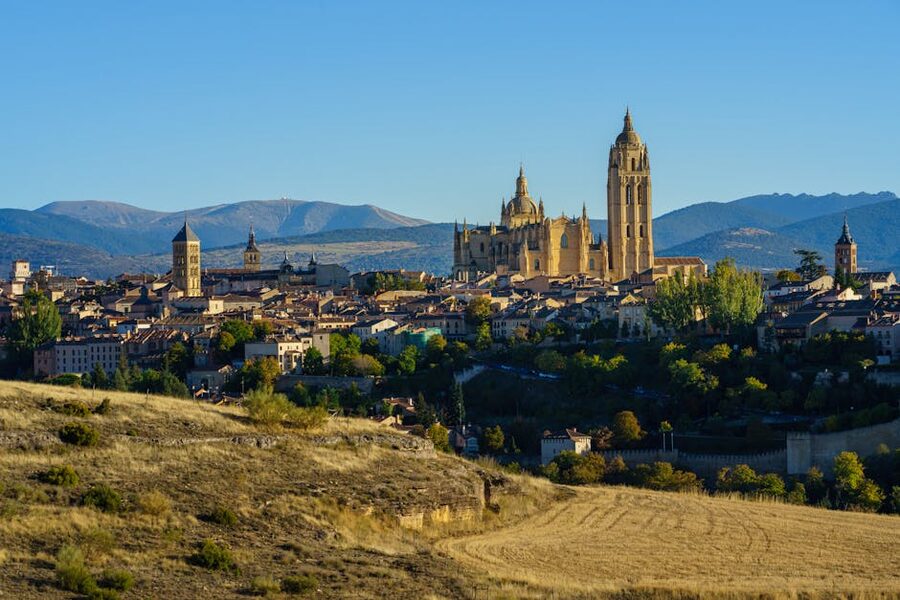 Segovia cathedral and medieval cityscape under cloudy sky