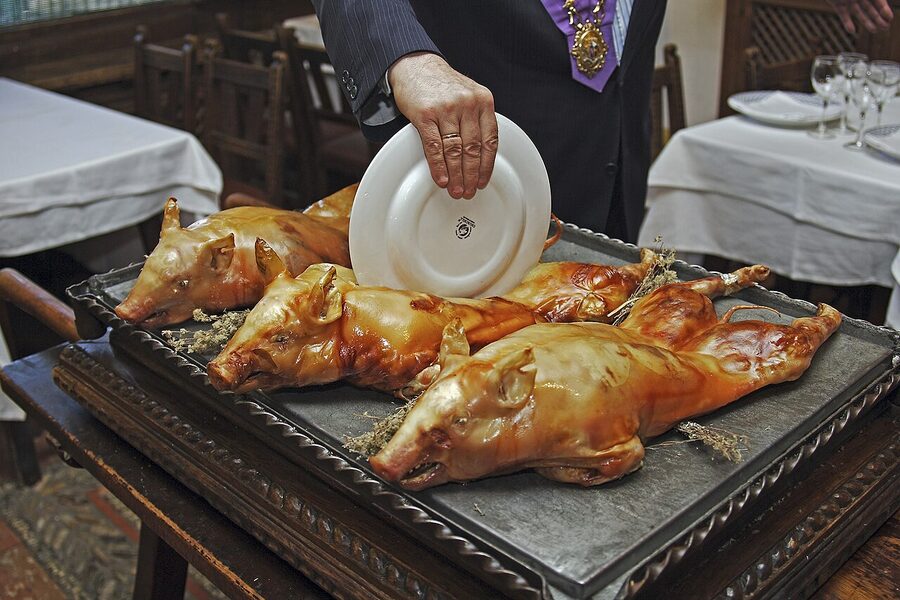 Cochinillo asado segoviano roast suckling pig on platter