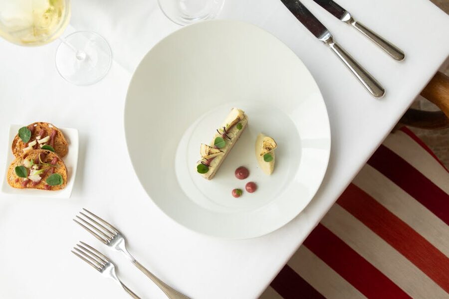 Top view of gourmet French cuisine plated on a fine dining table