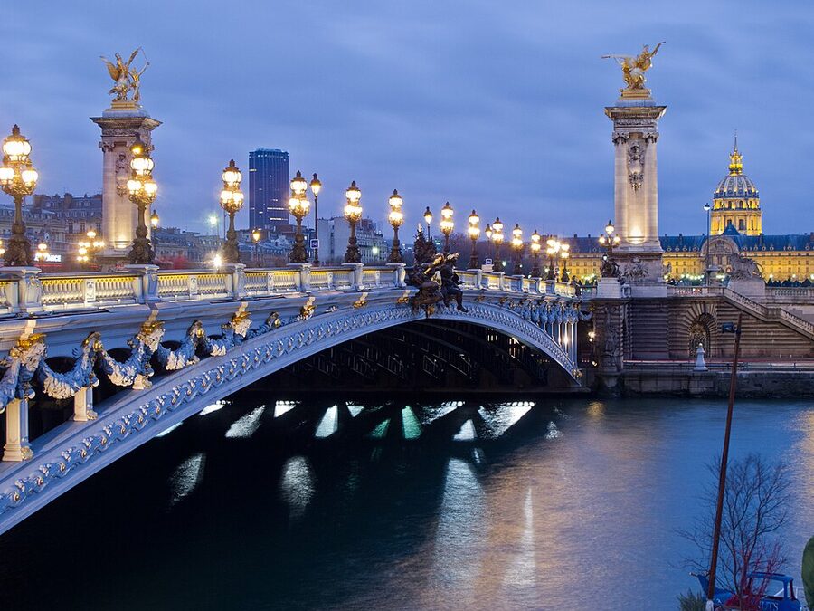 Pont Alexandre III in Paris in daylight showing the gilded statues and Beaux Arts ironwork