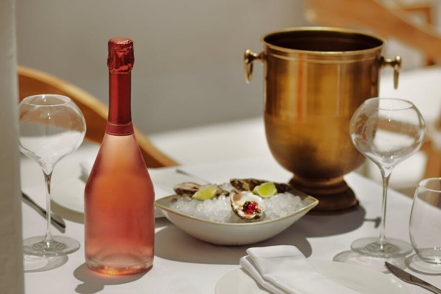 Sophisticated dining setup with rose wine and oysters