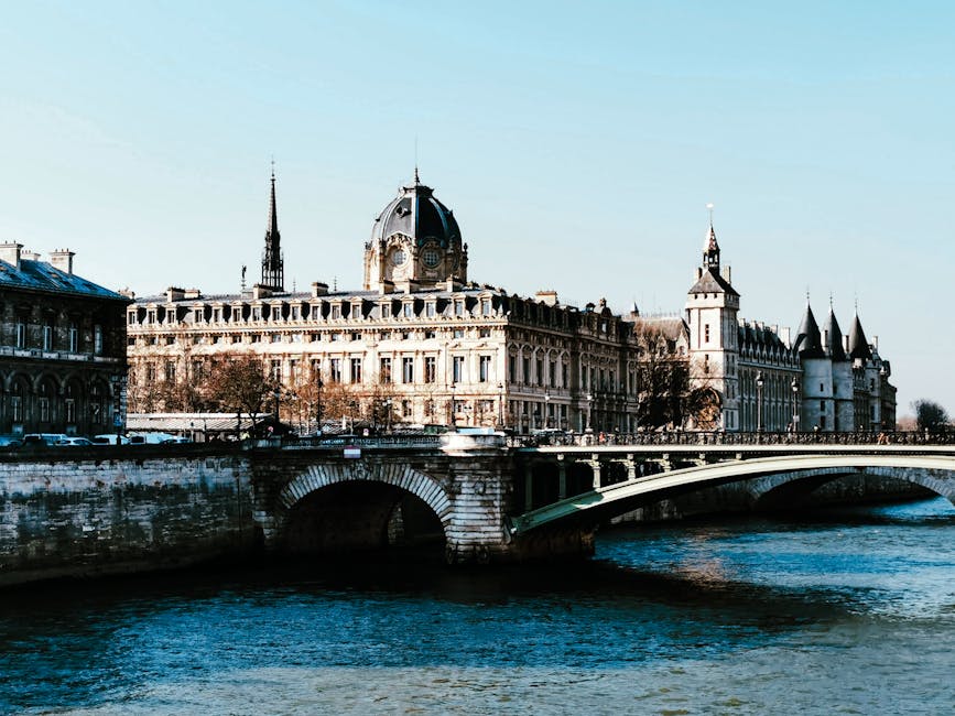 Pont au Change and La Conciergerie reflected on the Seine in Paris
