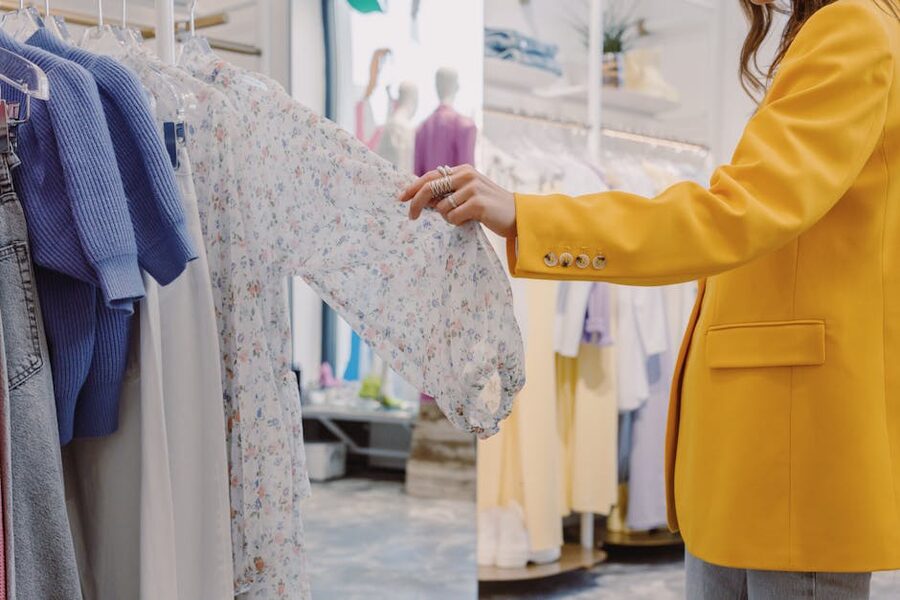 Woman browsing dresses in a boutique