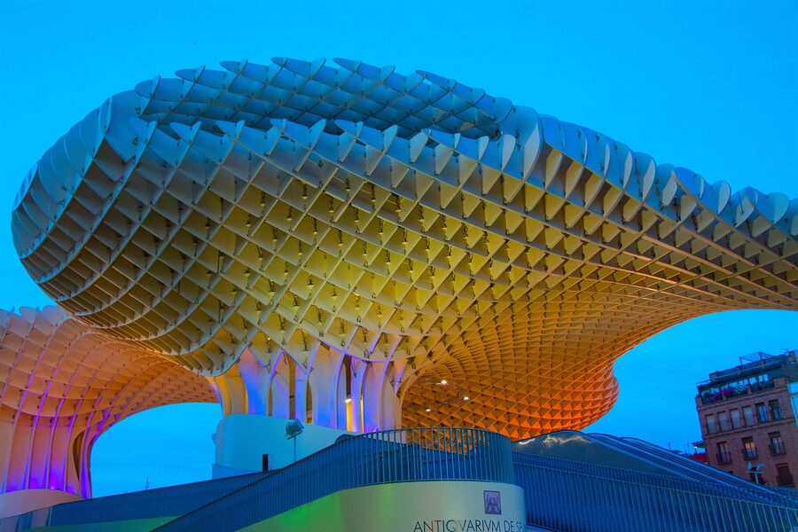 Setas de Sevilla glowing at night with the Aurora light show