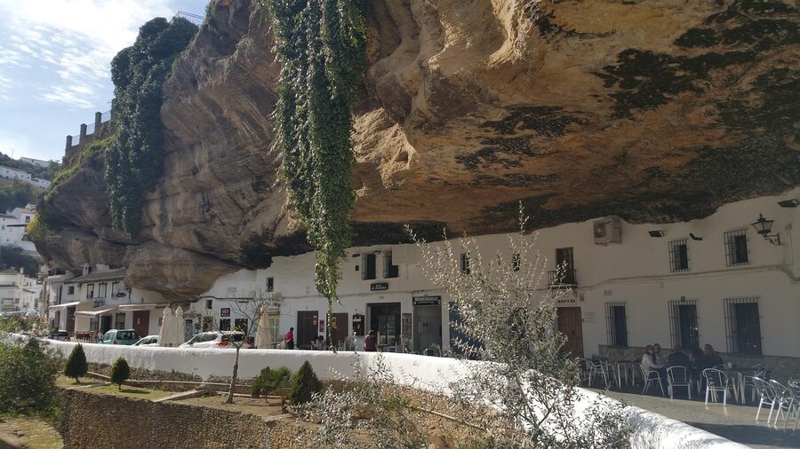 Setenil de las Bodegas houses built into rock cliff overhang
