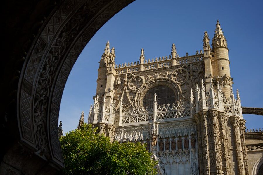 Gothic facade detail Seville Cathedral with sculptural figures