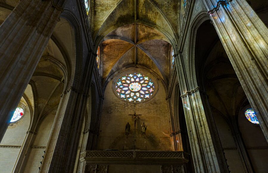 Seville Cathedral interior with stained glass windows