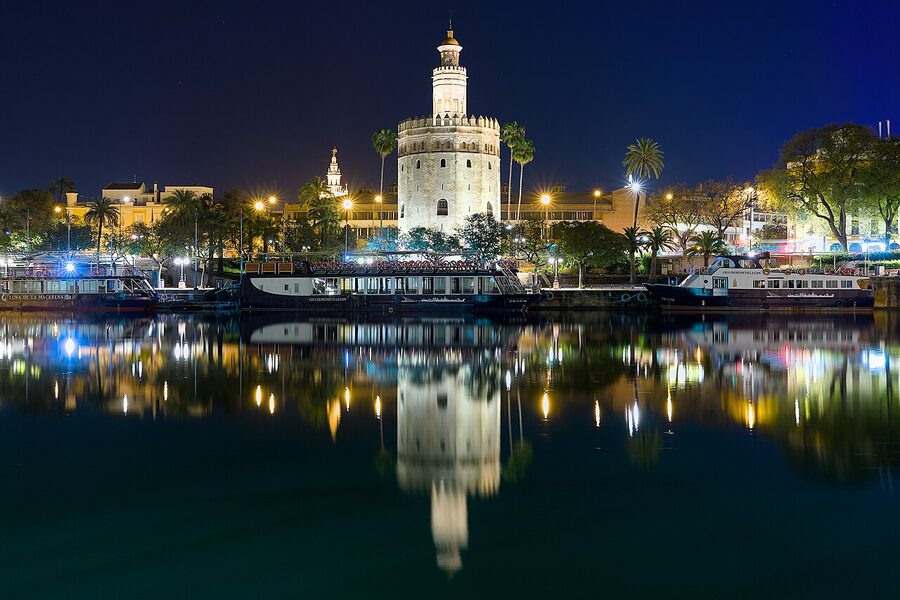 Torre del Oro at night with Guadalquivir reflection Seville