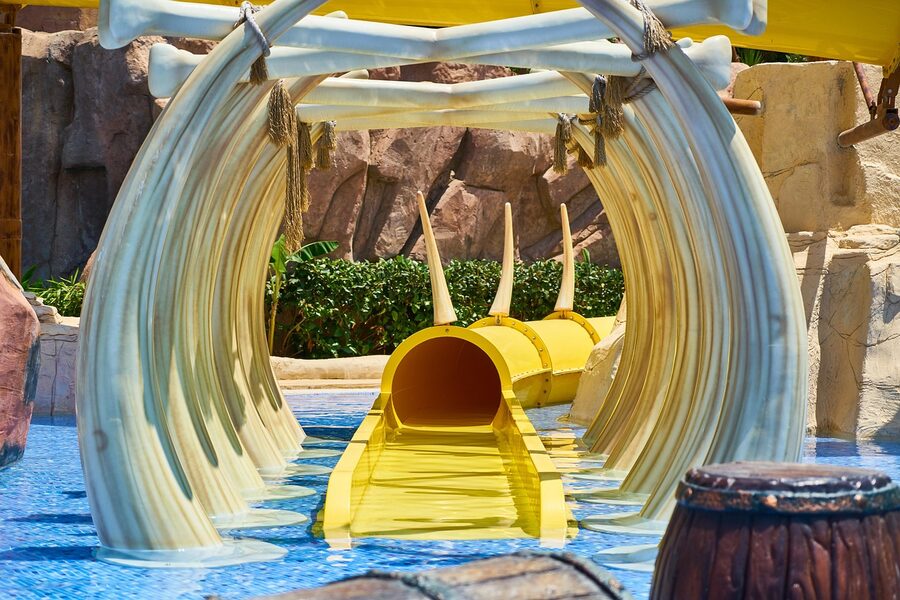Kids playing on water park slides
