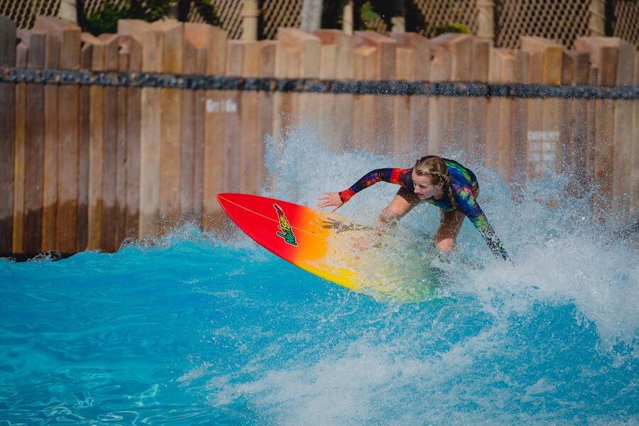 Wave pool surfer at water park