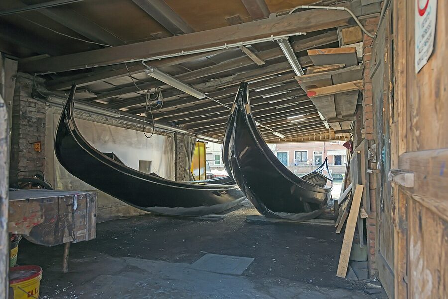 Interior of the Squero di San Trovaso gondola boatyard in Venice with a partly-built gondola