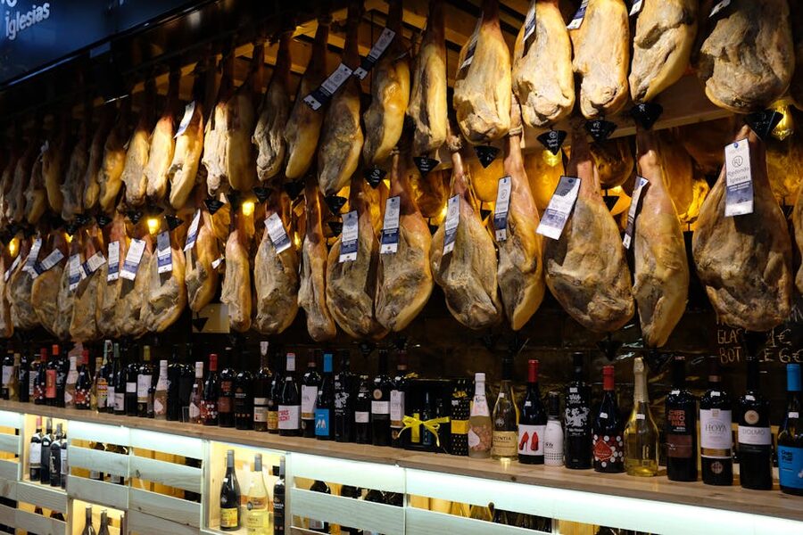 Hanging jamon and wine bottles in a Barcelona bar