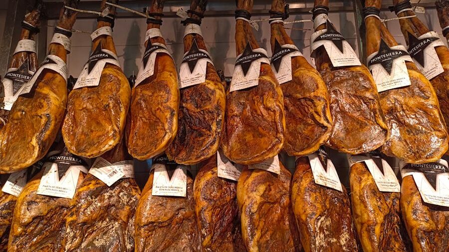Jamon Iberico hanging in a traditional Spanish bar