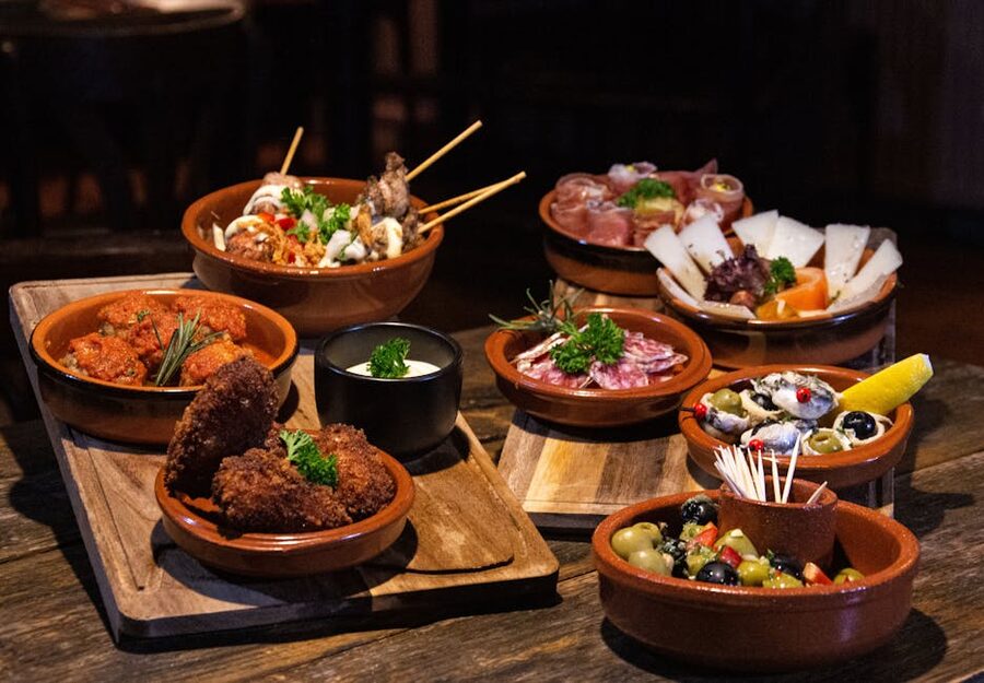 Spanish tapas spread on a rustic wooden table
