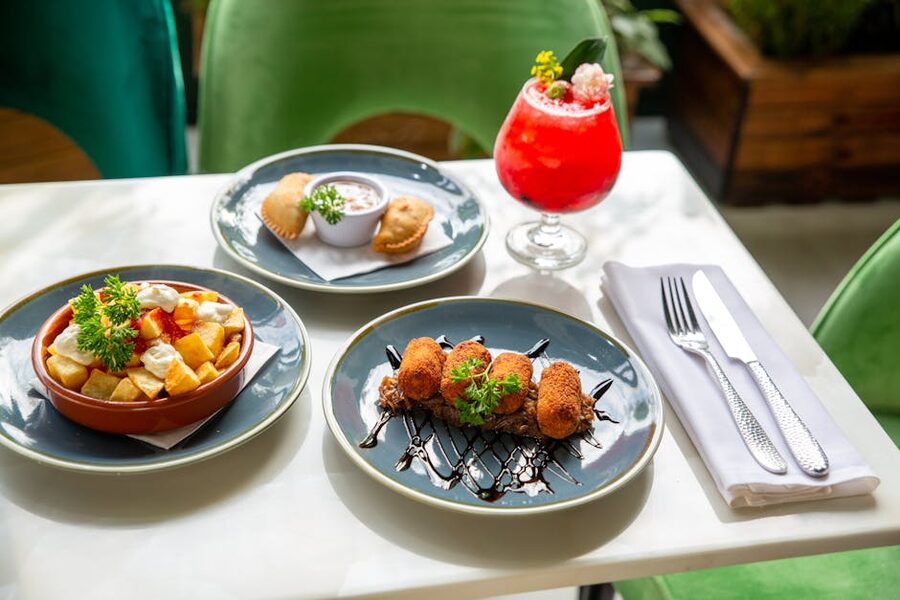 Spanish tapas spread paired with a cocktail