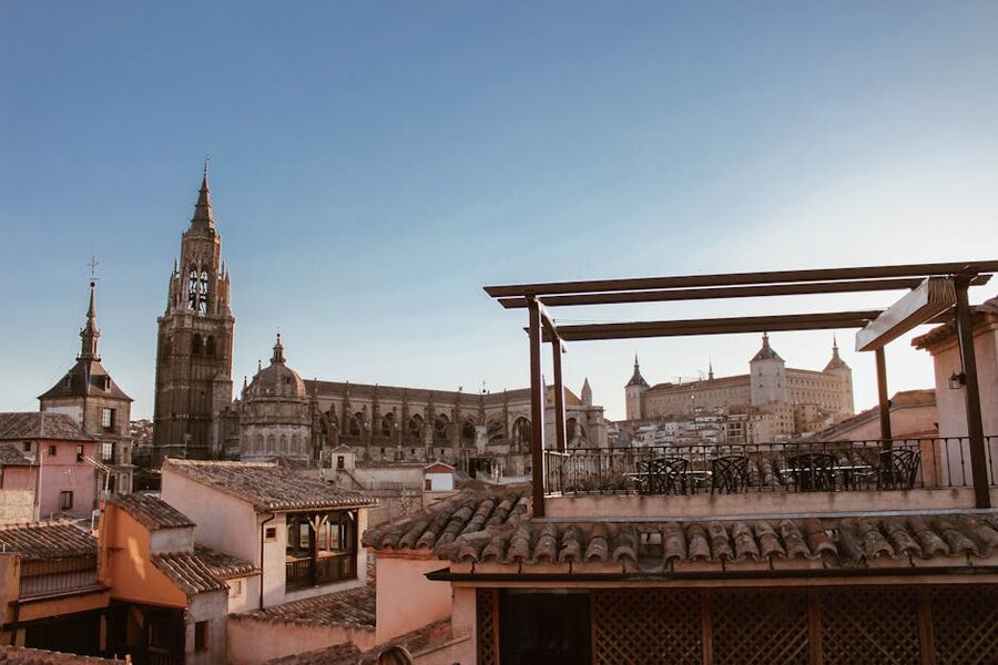 Toledo Cathedral Gothic spire rising above the city skyline against blue sky