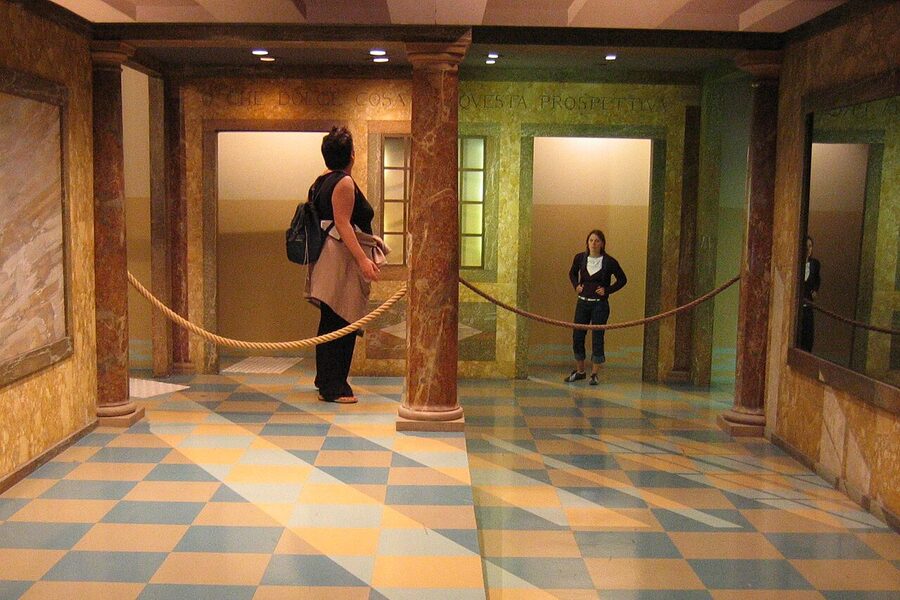 Ames room forced perspective optical illusion at an upside down museum venue