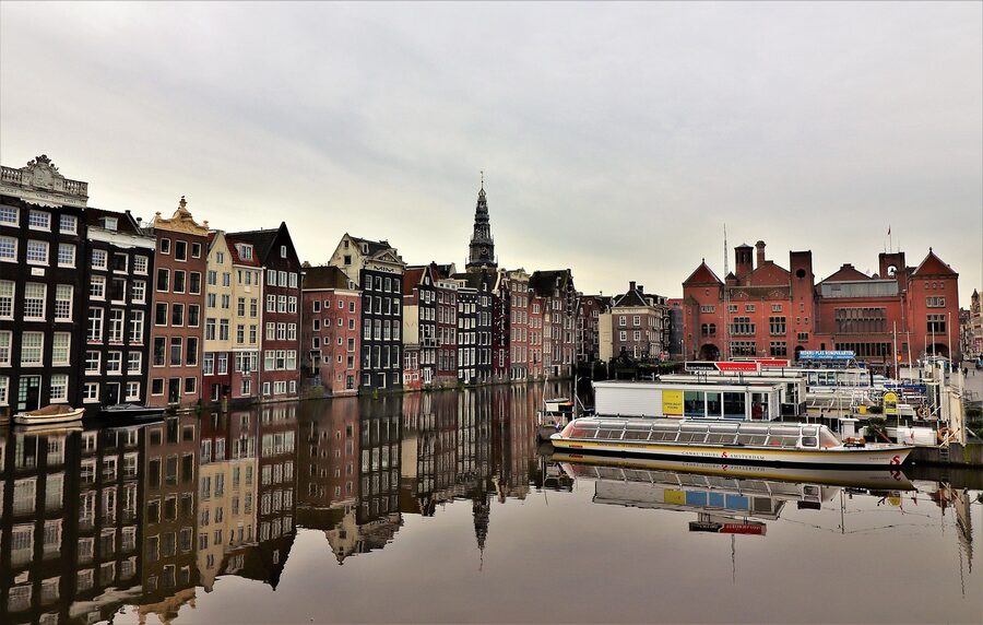 Damrak with Beurs van Berlage and the block where the Upside Down Museum sits