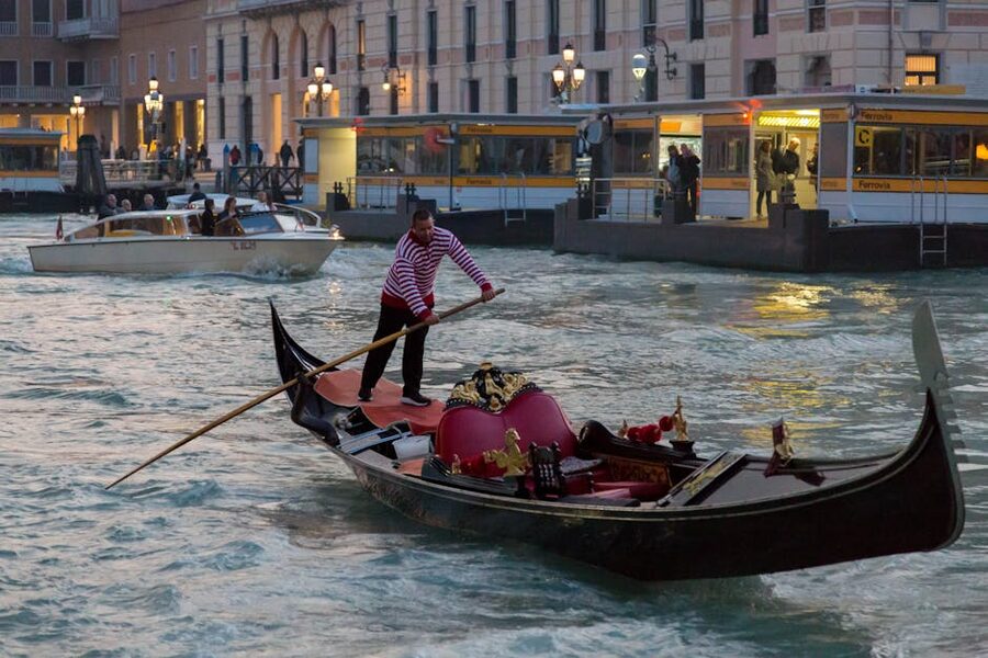 Gondola at dusk on a Venetian canal with warm evening light