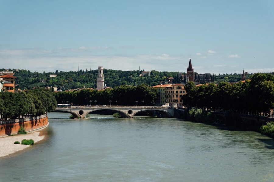 Adige river flowing through Verona under a clear sky