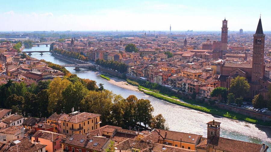 Stone bridge over the Adige river through historic Verona