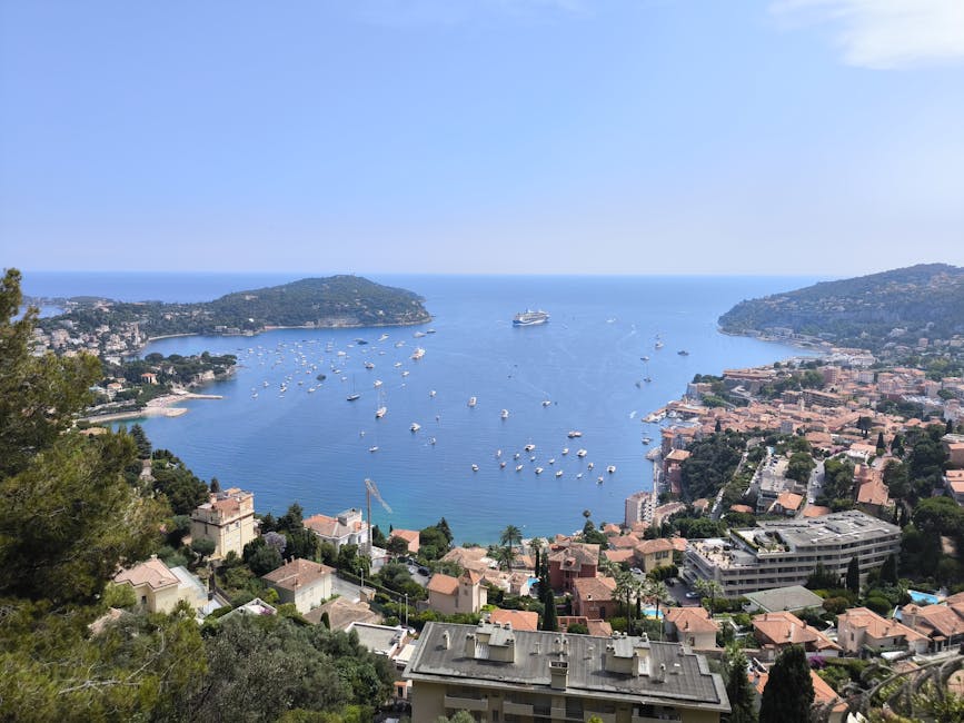 Villefranche-sur-Mer bay with sailboats and cruise ship anchored