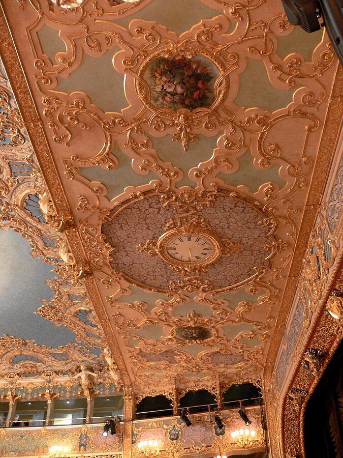 Detail of the gilded clock above the proscenium at La Fenice