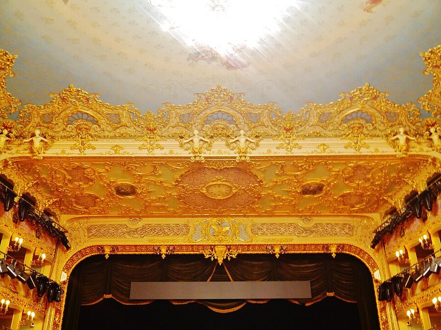 Painted ceiling detail at La Fenice with cherubs and gilded panels