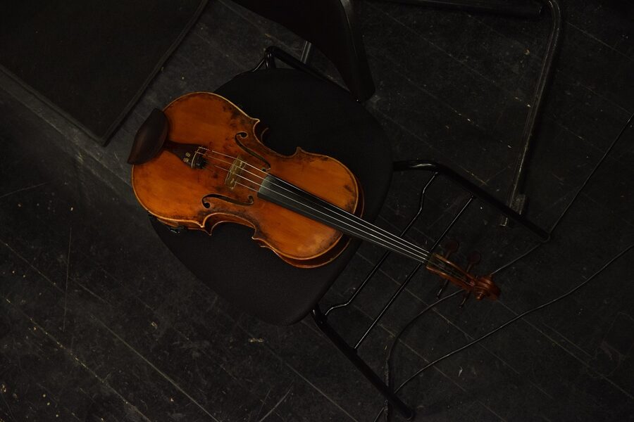 Close-up of violin and bow during a classical concert