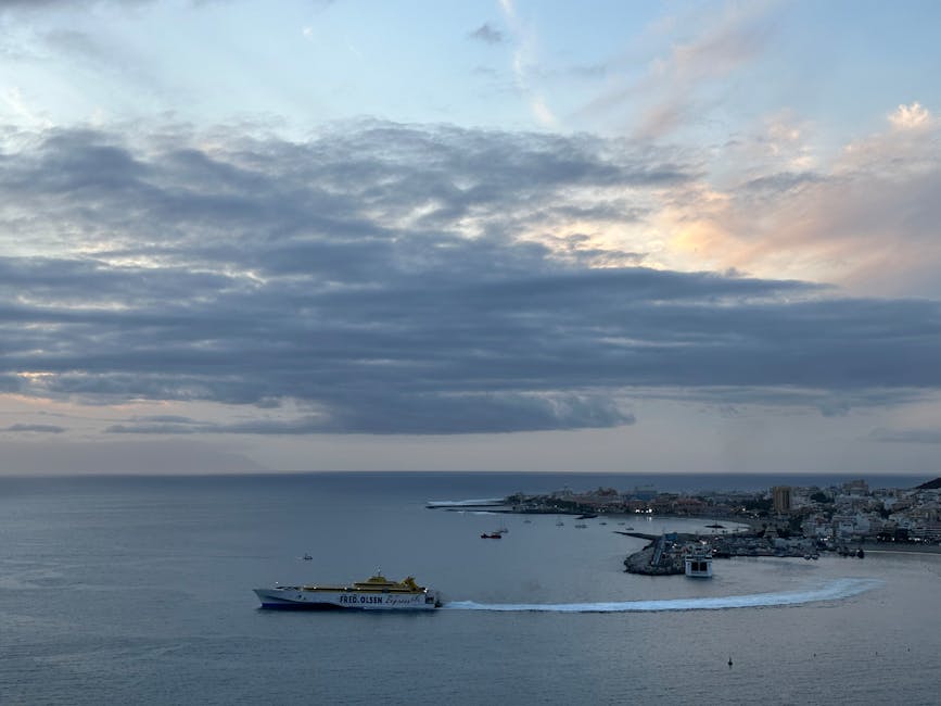 Los Cristianos harbour at twilight with ferry to La Gomera
